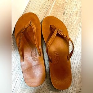 Women’s rainbow flip flops with braided strap